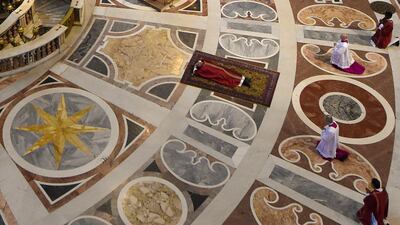Pope Francis lies on the ground to pray during the Celebration of the Lord's Passion on Good Friday at Saint Peter's Basilica in the Vatican City. Reuters
