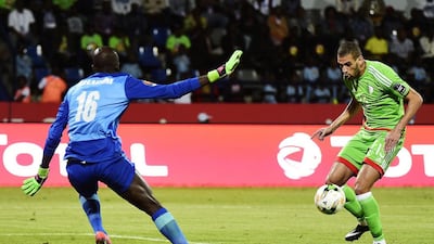 Algeria's forward Islam Slimani, right, controls the ball before scoring past Senegal's goalkeeper Khadim N'Diaye during the Africa Cup of Nations in Franceville. Khaled Desouki / AFP