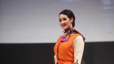 Etihad Airways says the new uniform has warm chocolate brown as the base colour for the different uniform variations, with a deep purple accent for cabin crew and lounge teams and a burnt orange accent for ground crew and special services teams. Lee Hoagland / The National