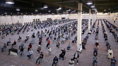 Expatriates returning from Egypt, Syria, and Lebanon arrive to be re-tested at a Kuwaiti health ministry containment and screening zone for Covid-19 coronavirus disease in Kuwait City on March 16, 2020. AFP