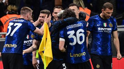 Inter Milan's German defender Robin Gosens celebrates with teammates after scoring. AFP