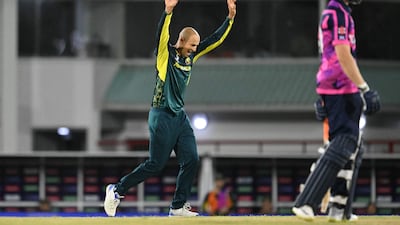 Australia bowler Ashton Agar celebrates after bowling out Scotland's Michael Jones. AFP