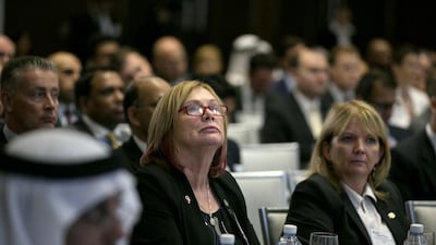 Noeleen Saeed of Abu Dhabi Holding, centre, listens in to a panel discussion during the 6th Annual Global UAE Investment Forum. Silvia Razgova / The National