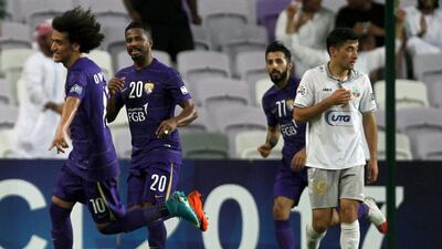 Omar Abdulrahman, left, celebrates after scoring from a free-kick in Al Ain's win over Bunyodkor. Nezar Balout / AFP