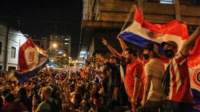 Paraguayans take part in a protest against President Mario Abdo Benitez's health policies and the lack of Covid-19 vaccines in front of the National Congress in Asuncion, Paraguay. Reuters