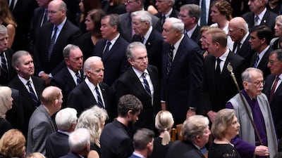 US former Vice President Joe Biden (C left) and actor Warren Beatty (C) arrive for the National Memorial Service. AFP
