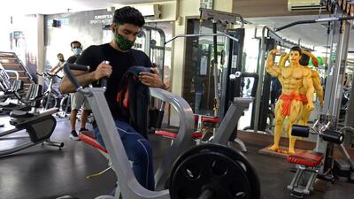 People workout at a gym in Mumbai, as India's financial hub.