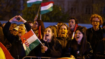 Supporters wait for Peter Magyar, leader of the opposition Tisza party, after the release of partial results of the election, in Budapest, Hungary. Reuters