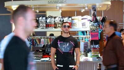 Rapper-entrepreneur Rachid Ben Messaoud is planning on using his chain of souvenir shops to help promote his music career. Pawan Singh / The National