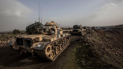 Tanks wait near the border in Hassa district of Turkey's Hatay province on January 22, 2018 as the Turkish prepares for an offensive on Syrian Kurd fighters in northern Syria. Sedat Suna / EPA