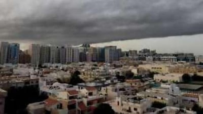 Smoke from a fire in Port Zayed blankets the sky over Abu Dhabi in May.