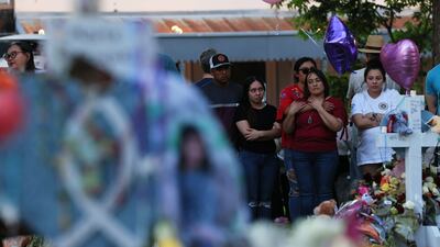 People visit a memorial for the victims. AFP
