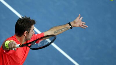 epa05182129 Stanislas Wawrinka of Switzerland serves to Nick Kyrgios of Australia during their semi final match of the Dubai Duty Free Tennis ATP Championships in Dubai, United Arab Emirates, 26 February 2016. EPA/ALI HAIDER