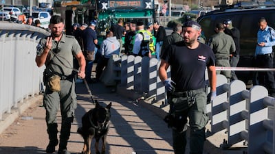 An Israeli security forces canine team in Jerusalem following explosion at a bus stop. AFP