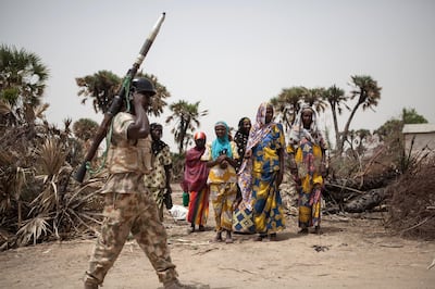A Nigerian soldier patrols the outskirts of the town of Damasak in north-east Nigeria as thousands freed from Boko Haram insurgents return home. AFP