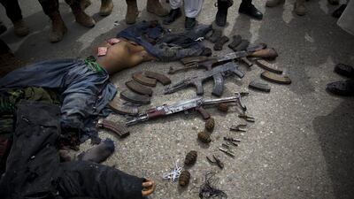 Afghan police surround dead suicide bombers. Police officials said three insurgents who tried to storm the former headquarters of Afghanistan’s intelligence service in southern Kandahar died in a gun battle with security forces.