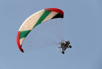 One of the paragliders in the UAE Rescue team gives a demo at Jazirat Al Hamra in Ras Al Khaimah in 2018. Pawan Singh / The National