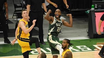Khris Middleton of the Milwaukee Bucks reacts after hitting the game-winning shot in overtime against the Miami Heat. AFP