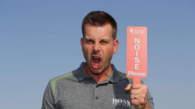 Henrik Stenson is pictured with a “Noise Please” sign during a photocall on the driving range before to the Abu Dhabi HSBC Championship at Abu Dhabi Golf Club on January 17, 2017 in Abu Dhabi, UAE. Courtesy Four Communications