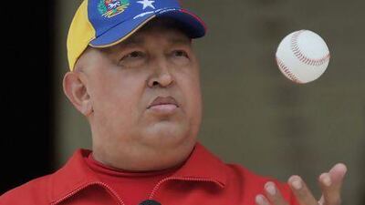 Hugo Chavez plays with a baseball during a broadcast at the presidential palace Miraflores in September, 2011.