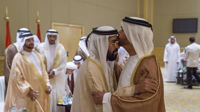 Sheikh Suroor bin Mohammed Al Nahyan, right, greets Sheikh Tahnoon bin Mohammed Al Nahyan, the Ruler’s Representative in the Eastern Region, left, during the wedding reception of Sheikh Tahnoon bin Hamad. Donald Weber / Crown Prince Court - Abu Dhabi