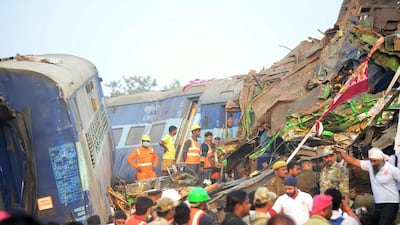 Indian rescue workers search for survivors in the wreckage of a train that derailed near Pukhrayan in Kanpur district on November 20, 2016. Sanjay Kanojia/AFP