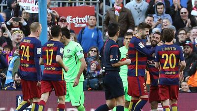 FC Barcelona’s Turkish midfielder Arda Turan (2R) celebrates with teammates after scoring against Getafe during their Spanish Primera Division soccer match at Camp Nou stadium in Barcelona, northeastern Spain, 12 March 2016. EPA/Toni Albir