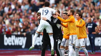 Rodrigo of Leeds United celebrates with teammates Marc Roca, Liam Cooper and Brenden Aaronson after scoring the team's first goal. Getty