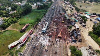 The operation to remove wreckage from the tracks gets under way. Reuters