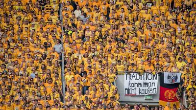 Dresden fans holding a banner reading "you cannot buy tradition", directed toward opponent RB Leipzig last week. Thomas Eisenhuth / AFP
