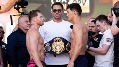 Saul Alvarez and Dmitry Bivol face each other after weighing in for their WBA light heavyweight fight. EPA
