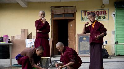 A group of young monks brush their teeth at the Kongri monastery. Thomas Cytrynowicz / AP Photo