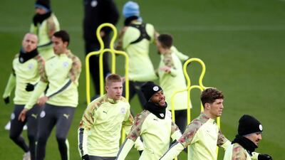 Manchester City players (from front right), Ilkay Gundogan, John Stones, Raheem Sterling and Kevin De Bruyne at the City Football Academy. PA