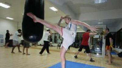 Gary Alford practises Muay Thai boxing, which is sometimes called "the art of eight limbs", at the Cobra Muay Thai Gym in Abu Dhabi.