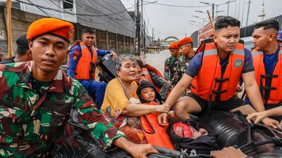 Rescuers evacuate flood-affected residents on rubber boats in West Java, Indonesia. EPA