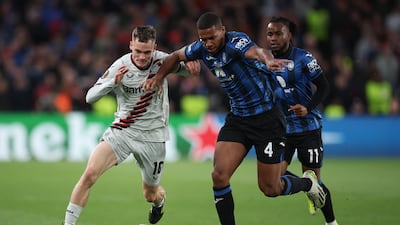 Leverkusen forward Florian Wirtz and Atalanta defender Isak Hien challenge for the ball. Getty Images
