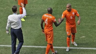 With midfielder Nigel de Jong, right, injured, Netherlands coach Louis van Gaal, left, has had to use inexperienced players in his defence and move others out of position to fill in the gap. Themba Hadebe / AP Photo