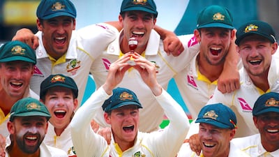 Then Australia captain Steve Smith holds a replica of the Ashes urn with his teammates after winning the series 4-0 in 2017. Reuters