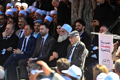 Walid Jumblatt, right, attends a ceremony to mark the 48th anniversary of his father Kamal Jumblatt's assassination, at El Moukhtara Palace, in Lebanon's Shouf mountains. AFP