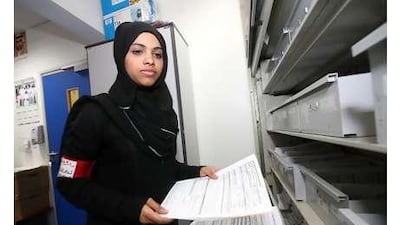 Sheikha Saeed Dhahi and Fatma Ateeqq mohammed, below, work at dubai's Rashid Hospital during leisure time.