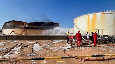 Firefighters work to extinguish flames in the Zawiya oil complex following drone strikes in Zawiya, Libya. Reuters