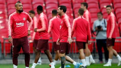 Arturo Vidal, left, watches his teammates during a training session at Wembley Stadium. AP Photo