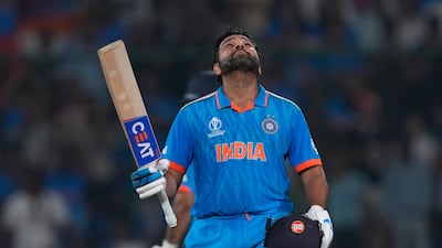 India's captain Rohit Sharma looks skywards as he celebrates his century. AP