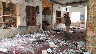 A Pakistani security officer stands amid the debris of a suicide bombing at a mosque in Quetta on January 10, 2020. EPA