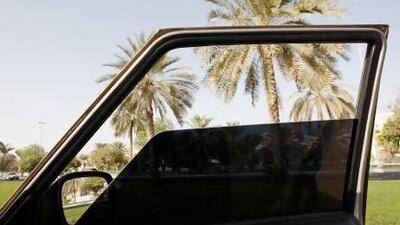 A car window with a 70 per cent tint. The legal maximum for tinting is 30 per cent. Philip Cheung / The National