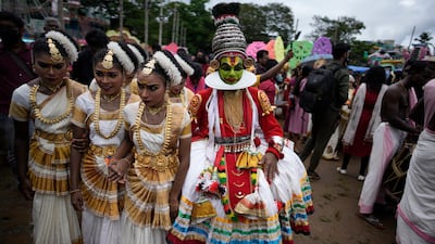 Children, dressed in classical dance costumes, participate in the Athachamayam procession marking the beginning of Onam festival in Kochi, southern Kerala state, India, Tuesday, Aug. 30, 2022. (AP Photo / R S Iyer)