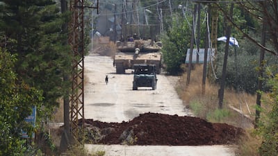 Israeli military Merkava main battle tanks are seen along the western entrance to the town of Khiam, southern Lebanon, on Tuesday. AFP