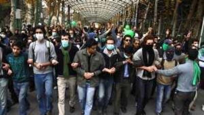 Pro-reform Iranian students, some shouting 'death to the dictator', protest at the Tehran University campus on Monday.