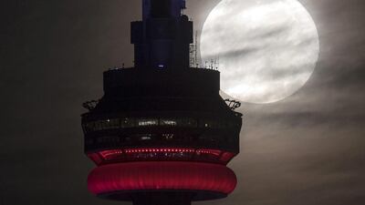 The supermoon behind the CN tower in Toronto. Frank Gunn / The Canadian Press via AP