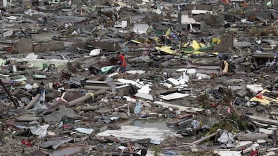 Destroyed houses lie in Tacloban city, Leyte province, central Philippines. Bullit Marquez / AP Photo